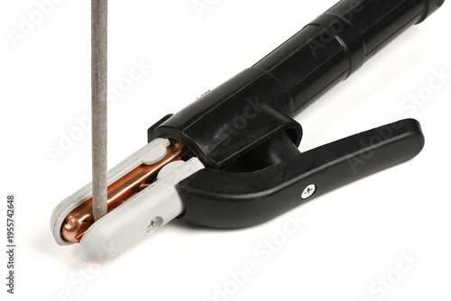 Canvas-taulu Close-up of welding electrode holder clamp gripping a rod