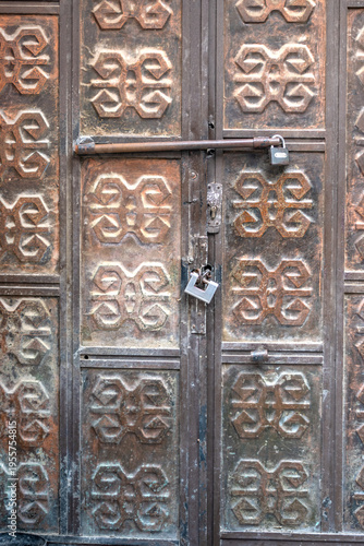 Close-up of an ornate iron door from the Ottoman era. Detailed craftsmanship showcasing traditional metalwork, historical architecture, cultural heritage, and decorative patterns.
