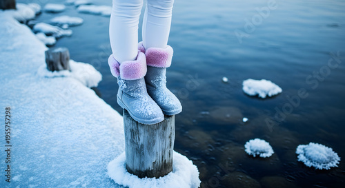 Winter Boots on Snowy Post by Icy Water