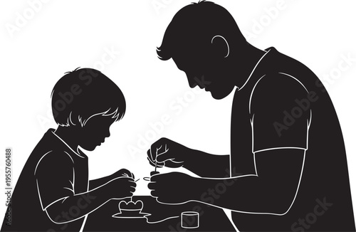 Father and son crafting together at a table, symbolizing hands-on activities, learning new skills, and quality family time.