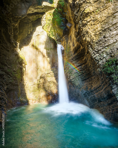 A rainbow in the waterfall gorge