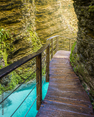 A gorge path above lush green river