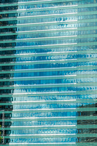 Canada, Alberta, Calgary.  Reflections in the glass of highrise office towers in the financial district.