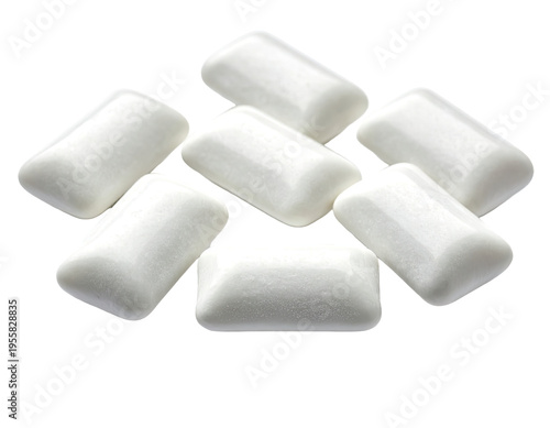 A cluster of white, rectangular chewable confectionary pieces