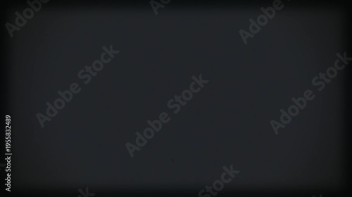 Vintage noisy black film background with vignette. Copy space on centre. Scratches, details and noise. Dusty and grainy feel. 4K motion graphics.