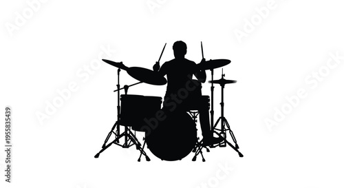 Drummer playing a full kit in striking black silhouette