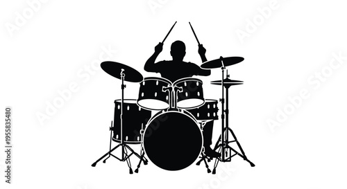 Drummer playing a full kit in a striking black silhouette