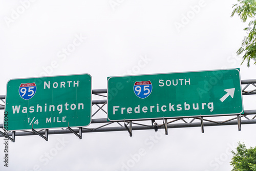 Woodbridge, Virginia street near Washington DC with road sign closeup for highway i95 interstate exit turn to north or south to Fredericksburg