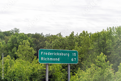 Richmond Fredericksburg road sign on Virginia interstate i-64 highway with distance sign in summer