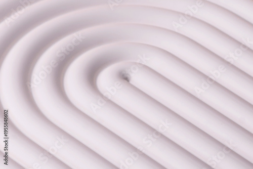 A beige background with a white podium for copy space items or cosmetics. A beige background