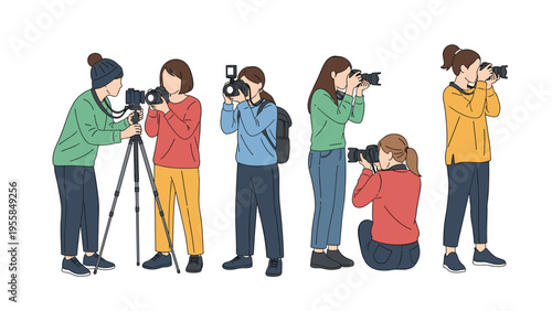 Diverse group of female photographers in various poses using cameras and tripods to capture images and video during a photography workshop.