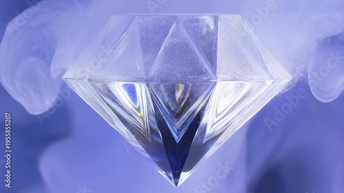 Faceted clear crystal in blue liquid and mist