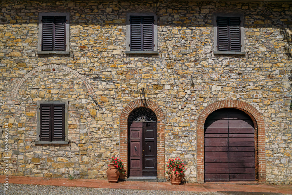 Obraz premium Facade of an old stone villa at a vineyard, Chianti wine Region, Tuscany, Italy