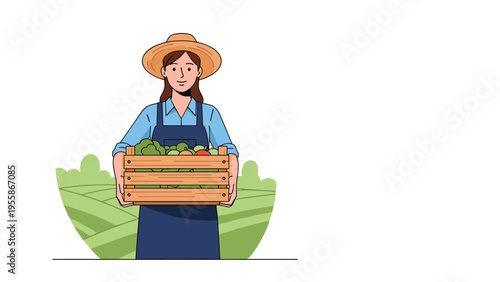 Smiling female farmer holding a wooden crate filled with fresh organic vegetables in front of green agricultural fields.