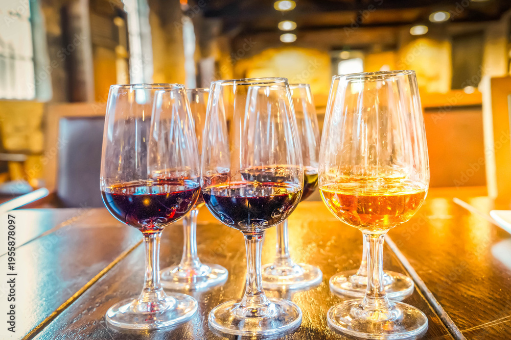 Fototapeta premium port wine testing, glasses with drink samples in bar