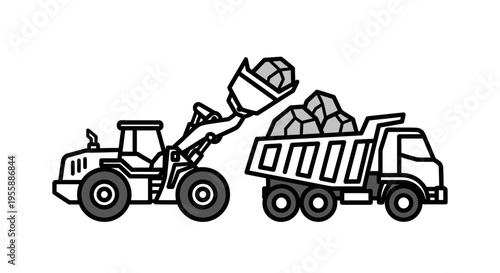 Heavy machinery loading a truck.