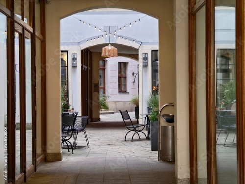 Cuadro en lienzo Elegant courtyard with cozy seating