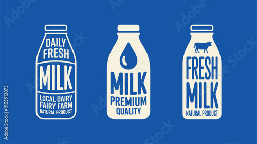 White milk bottles display various fresh dairy product labels and cow symbol