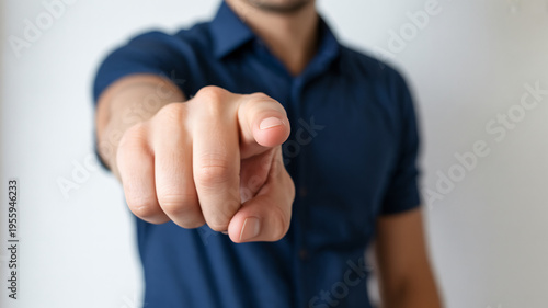 A man pointing his finger in a gesture of accusation or direction