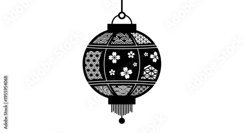 A black and white illustration of an intricately designed hanging ornament.