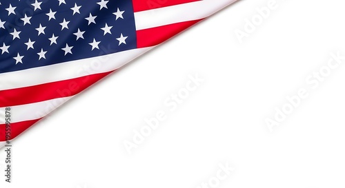 A high angle view of the corner of an american flag folded over a plain white background surface