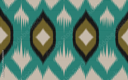 Teal and olive ikat diamond patterns on a woven textile rug