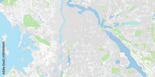 Aerial view of a city with rivers and green spaces