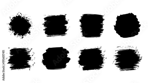 Black ink brush strokes and paint splatters for artistic graphic design and grunge background elements