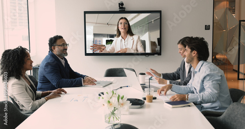 Canvas Print Diverse business team staff meeting at office table, talking to female company l
