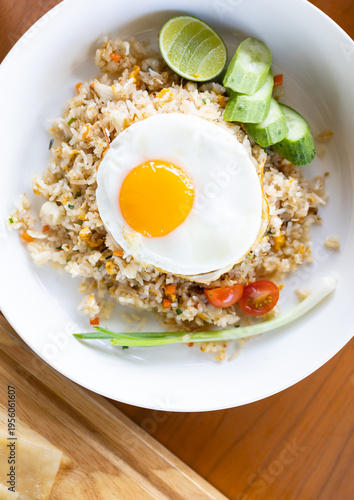 Seafood fried rice with fried egg.