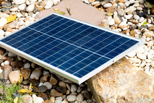 Solar panels in a rock garden.