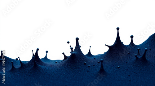Deep blue liquid surface forms sharp crown-like with hanging droplets, captured in high-speed motion against background,