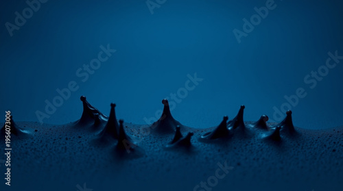 Deep blue background with liquid surface forming sharp peaks resembling ice cones or volcanic craters, intricate texture