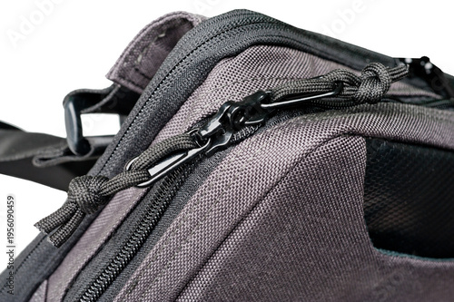 A small grey bag with a long adjustable handle.