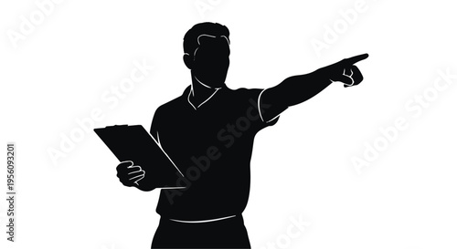 Silhouette of businessman pointing with tablet in hand in modern office setting with presentation gesture