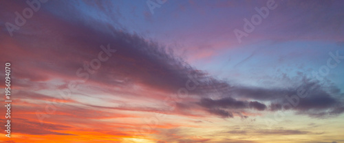 Bild auf Leinwand Beautiful Dramatic Sunset Sky with Purple and Orange Altocumulus Clouds,Stunning low angle view of a twilight sky filled with colorful altocumulus cloud formations