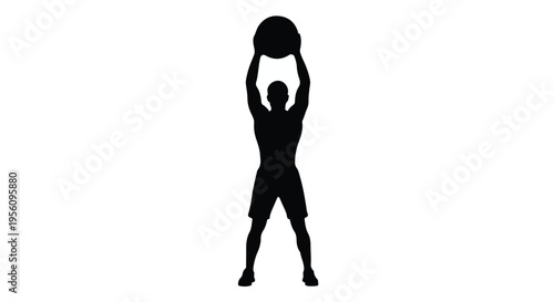 Man exercising with medicine ball in fitness training silhouette