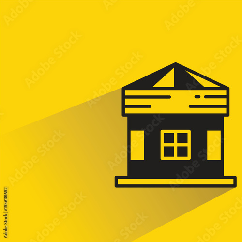 house building icon with shadow on yellow background
