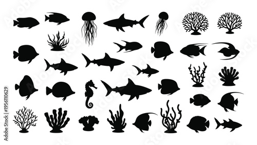 Collection of black silhouettes of various marine life and coral reef elements
