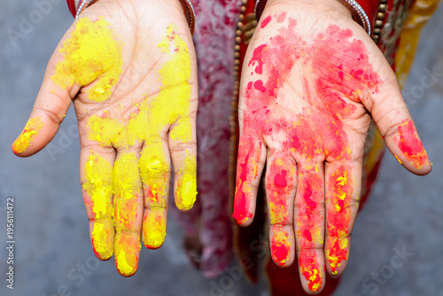 Hands covered with colorful powder paint, Holi festival celebration and vibrant culture concept