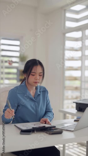 Asian business professionals celebrating success achievement in modern office workplace with laptop computer technology business growth victory team