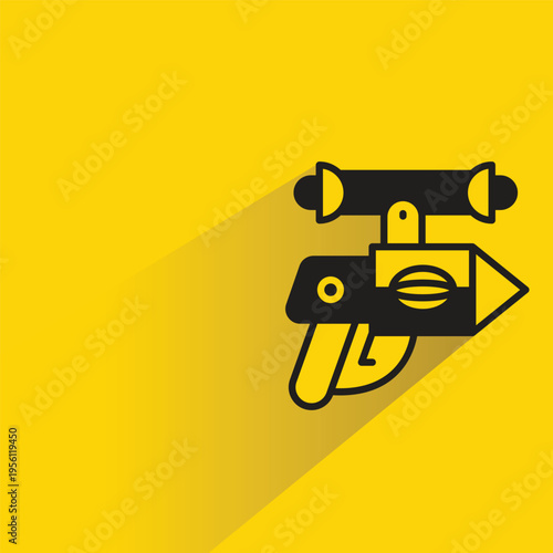 space gun icon with shadow on yellow background