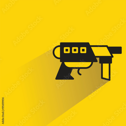 space gun icon with shadow on yellow background