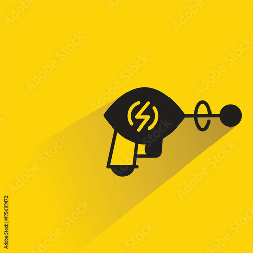 space gun icon with shadow on yellow background