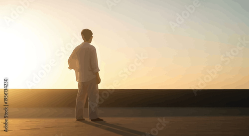 Man standing alone on rooftop looking out at sunset