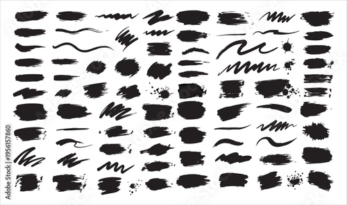 Collection of various black brush strokes and marks on a white background.