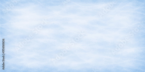 A serene blue ice surface showing many lines from skate. capturing the cool and the potential for a day of thrilling activities.