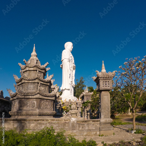 Standing Buddha statue against sky at Tong Lam Son Temple Nha Trang Vietnam