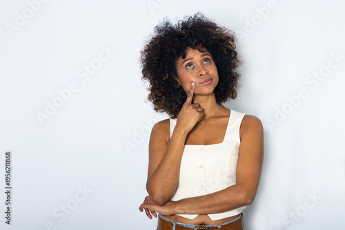 young woman isolated against a background, thinking