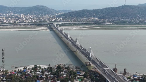 Cinematic view of Kumar Bhaskar Varma Setu bridge with vehicular traffic, Guwahati to North Guwahati, Assam, India